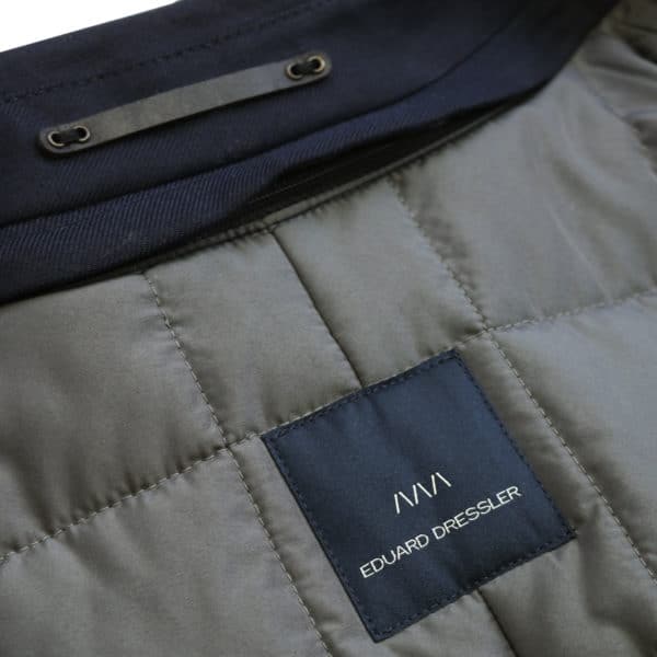 Eduard Dressler navy raincoat logo detail